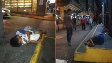 Photo of Homeless boy clings to his puppy for love and warmth as everyone walks by