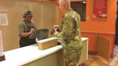 Photo of The soldier is in the process of paying for his order, but he has a change of heart upon hearing two boys, who are visibly shivering, express their hunger.