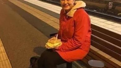 Photo of A woman is waiting for a train to return home