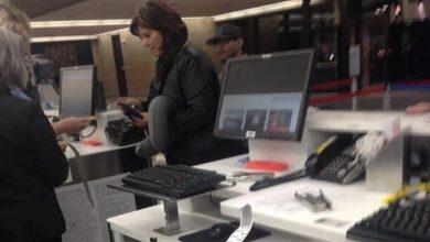 Photo of This image of a woman at an airport is gaining viral attention. Take a closer look, and you’ll understand why.