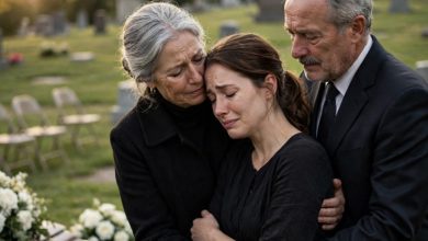 Photo of Two Caskets and One Woman Who Couldn’t Stand